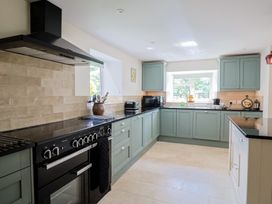 A kitchen with cabinets and appliances at Harbins Farm Glanvilles Wootton Nr. Sherborne