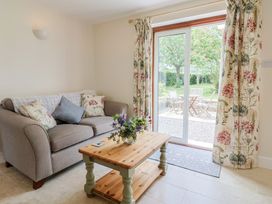 A living room with a sofa and coffee table at Harbins Farm Glanvilles Wootton Nr. Sherborne