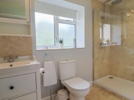 A bathroom with a shower and sink at Harbins Farm Glanvilles Wootton Nr. Sherborne