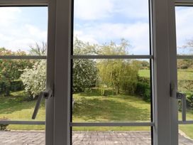 A view of a garden with trees and grass at Harbins Farm Glanvilles Wootton Nr. Sherborne