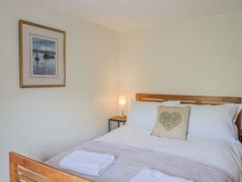 A bedroom with a bed and lamp at Harbins Farm Glanvilles Wootton Nr. Sherborne