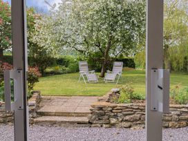A garden with two deck chairs and a tree at Harbins Farm Glanvilles Wootton Nr. Sherborne