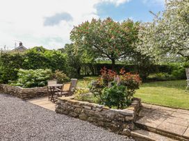 A garden with chairs and plants at Harbins Farm Glanvilles Wootton Nr. Sherborne