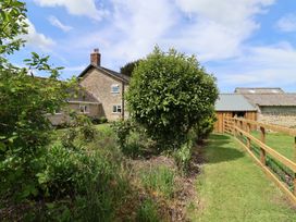 A house with a garden and fence at Harbins Farm Glanvilles Wootton Nr. Sherborne