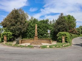 A roundabout with an obelisk and greenery at Harbins Farm in Glanvilles Wootton Nr. Sherborne