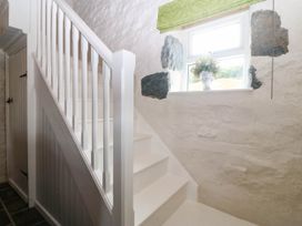 A staircase with a window at Little Oak near Tal-Y-Bont