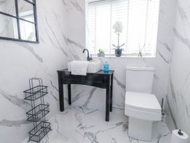 A bathroom with a sink and toilet at Hen Fecws Rhoshirwaun near Sarn Meyllteyrn