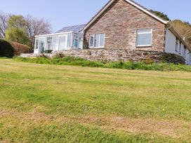 A house with a conservatory and solar panels at Tregoning in Lostwithiel
