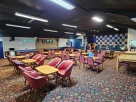 A bar area with tables and chairs at Watersmeet - 85 @ Park Avenue Holiday Village Leysdown-On-Sea, Kent