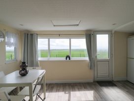A dining room with a table and chairs at Watersmeet - 85 @ Park Avenue Holiday Village Leysdown-On-Sea, Kent