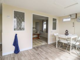 A dining room with a table and chairs at Watersmeet - 85 @ Park Avenue Holiday Village, Leysdown-On-Sea, Kent