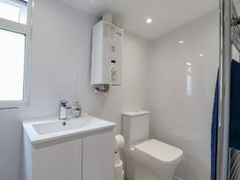 A bathroom featuring a sink and a toilet at Watersmeet - 85 @ Park Avenue Holiday Village, Leysdown-On-Sea, Kent