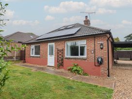 A front view of a bungalow with solar panels at 2 North Road, Maiden Newton, Dorset