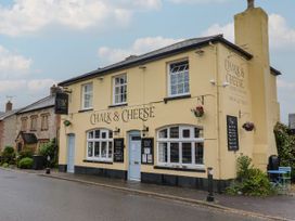 A pub exterior with signage and flower planters at 2 North Road Maiden Newton