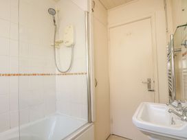 A bathroom with a shower and sink at Wootton Gray in Penzance