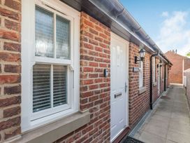 An exterior view of a house entrance with a window and door at Rails End