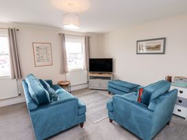 A living room with a sofa and television at Rails End 