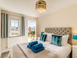 A bedroom with a bed and lamps at Rails End