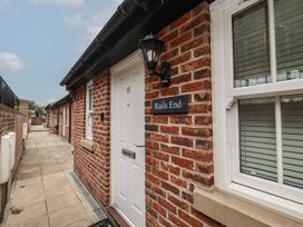 An entrance with a door and nameplate at Rails End in Whitby
