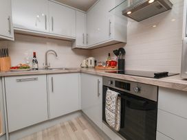 A kitchen with sink and appliances at Rails End in Whitby