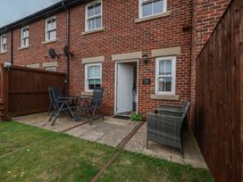 An outdoor area with a table and chairs at Rails End in Whitby