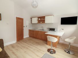 A kitchen with cabinets and appliances at 17 ROOSKA in Lisdoonvarna, County Clare