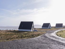 A view of multiple houses next to a road at Cabin 2 Min Larach in Gortahawk