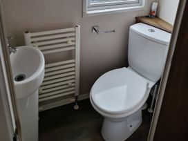 A bathroom with a sink and toilet at Harbour Watch 22 Watchet