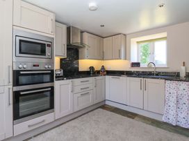 A kitchen with cabinets and countertop at The Annexe at Dalby Carr