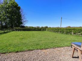 An outdoor space with grass and trees at The Annexe at Dalby Carr