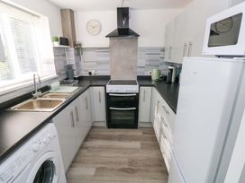 A kitchen with a sink and oven at The Gower Gateway in Gowerton near Swansea