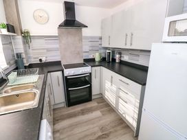 A kitchen with appliances and sink at The Gower Gateway in Gowerton near Swansea