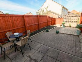 A garden with a table and chairs at The Gower Gateway in Gowerton near Swansea