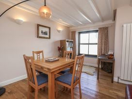 A dining room with a table and chairs at Fleming Cottage