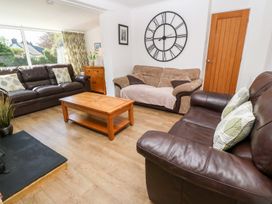 A living room with a sofa and coffee table at Tinners Way in Helston