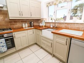 A kitchen with cabinets and a sink at Tinners Way in Helston