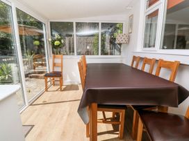 A dining area with a table and chairs at Tinners Way Helston