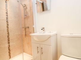 A bathroom with a shower and a sink at Tinners Way in Helston