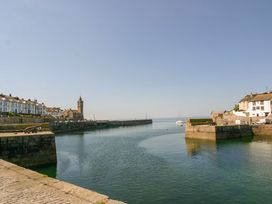 A harbor with boats and buildings at Tinners Way in Tresowes near Ashton