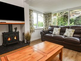 A living room with a sofa and television at Tinners Way Tresowes near Ashton