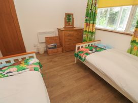 A bedroom with two beds and a dresser at Tinners Way in Tresowes near Ashton
