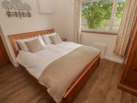 A bedroom with a bed and a window at Tinners Way Tresowes near Ashton