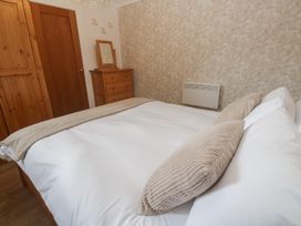 A bedroom with a bed and furniture at Tinners Way in Tresowes near Ashton