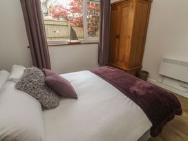 A bedroom with a bed and wardrobe at Tinners Way Tresowes near Ashton