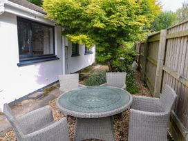 A garden with a round table and chairs at Tinners Way in Tresowes near Ashton
