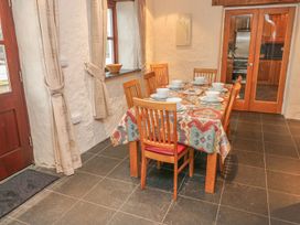 A dining room with a table set for meals at Maerdy Cwtch in Haverfordwest