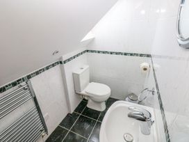 A bathroom with a toilet and sink at Maerdy Cwtch in Haverfordwest