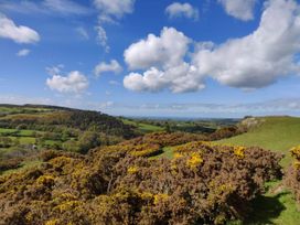 A landscape view with hills and clouds at Hapus Yurt - Two Beautiful Yurts and Barn Cottage