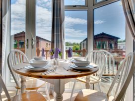 A dining table set for a meal at Pet-friendly lodge with hot tub near the coast
