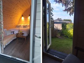 A bedroom with a bed and outdoor view at tbc 